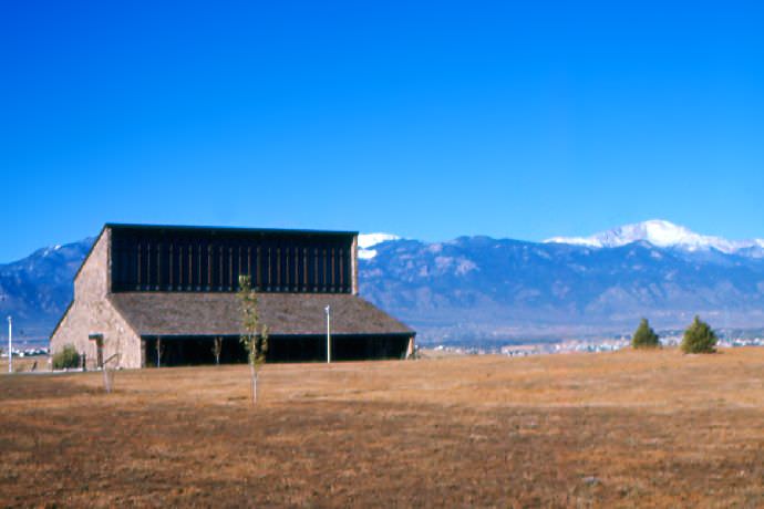 The Administration and Library Building (Sanders Building) with Pikes Peak in the background.