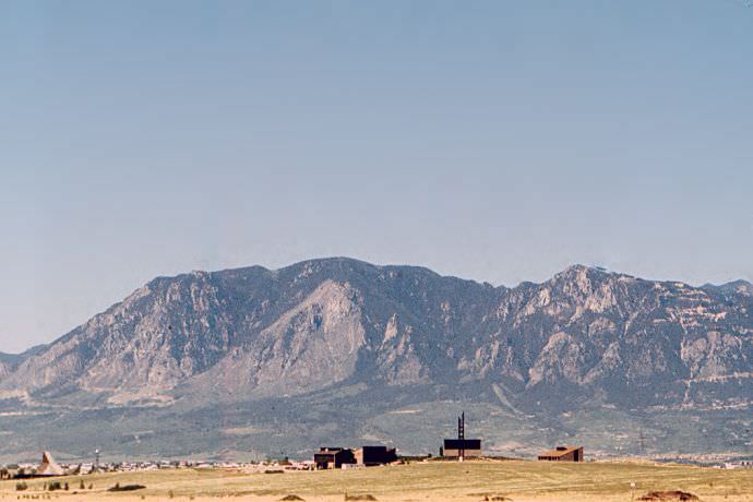 This is an old photo of Cheyenne Mountain and NORAD with the Nazarene Bible College in the foregrou