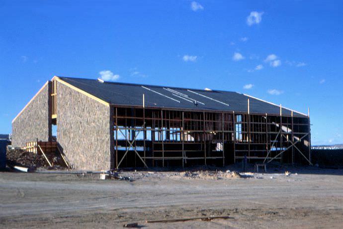 A shot of Leist, from the parking lot side, with its rock walls up and the roof being worked on.