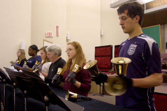 These students are learning to play the bells in the Oliver Hall auditorium.