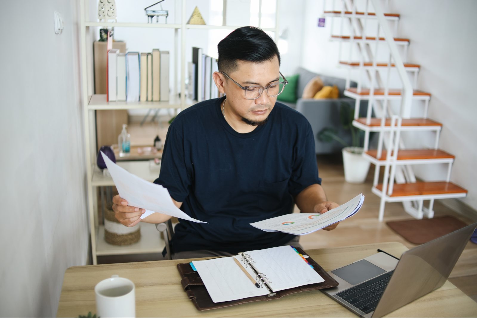 man reviewing college resources