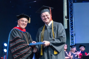 President Graves with 2019 Graduate