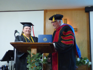 Michelle Jennett with Dr. Alan Lyke at her graduation celebration.